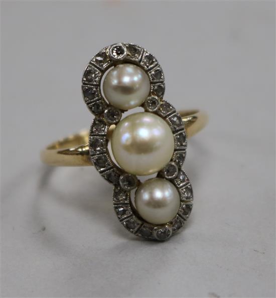 A yellow metal, cultured pearl and rose cut diamond triple cluster upfinger ring, size Q.